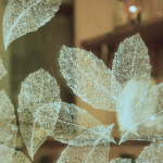 Detail of sandblasted leaf motif on residential glass panel