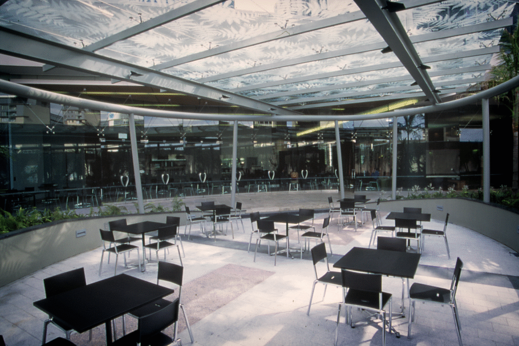 Café area with dappled fern leaf glass skylight at Vero corporate offices